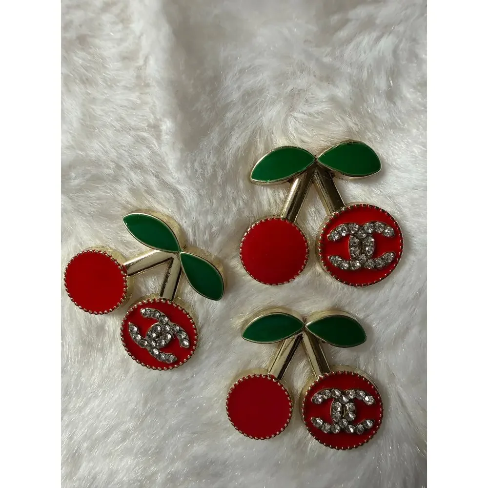 Designer inspired charm with cherries and double C logo in Rhinestones